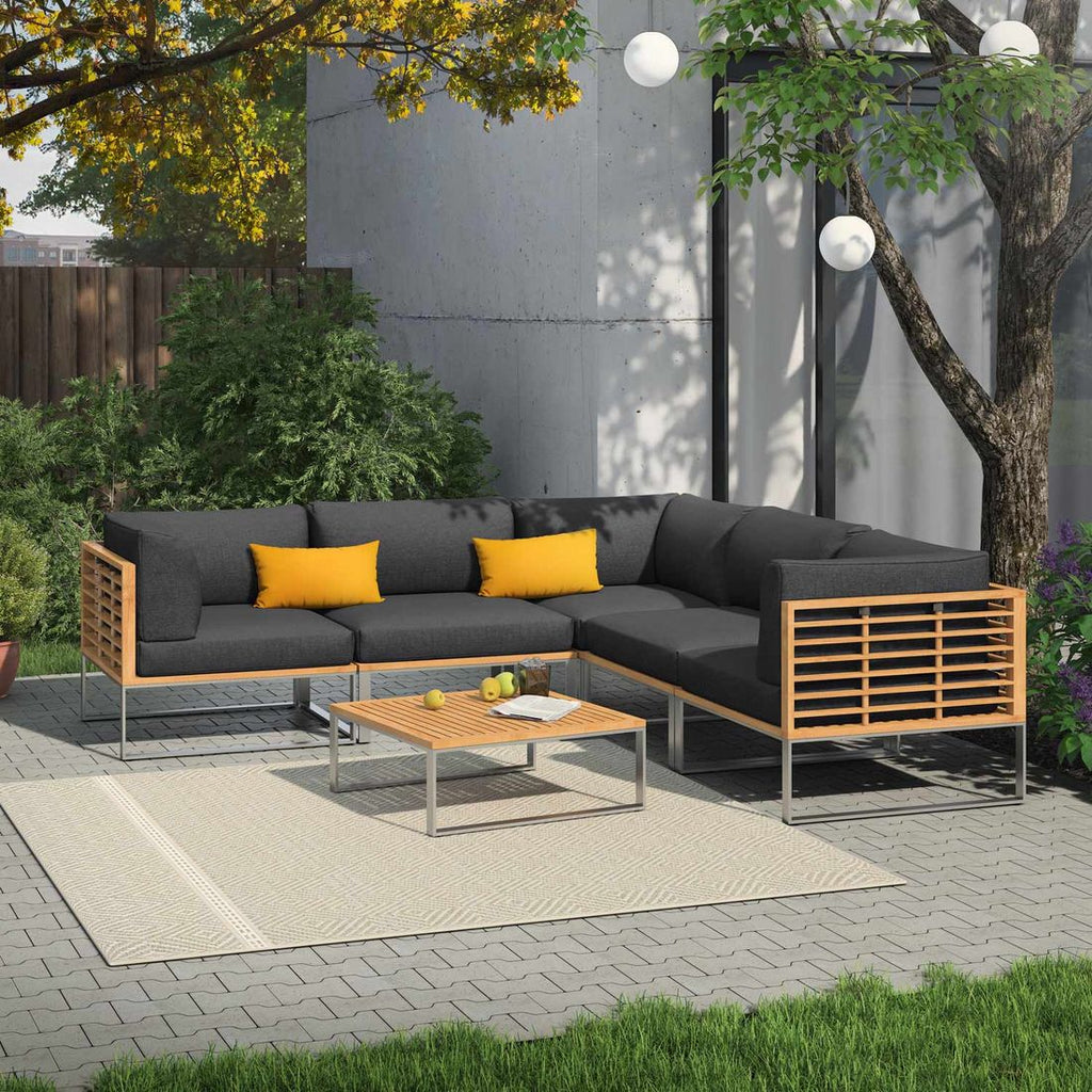 Loungetaburett Sumba rustfritt stål/teak med pute på balkong